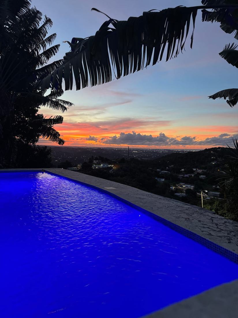 Villa Vista pool at sunset overlooking the coast